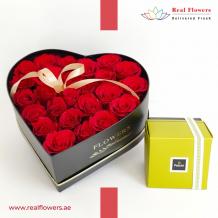 red roses heart box with chocolates